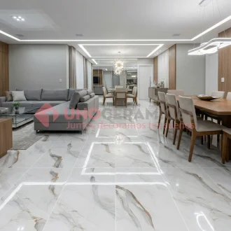 Piso marmolizado brillante Meridian Gold 60x120 en sala de lujo - unoceramicas SAS